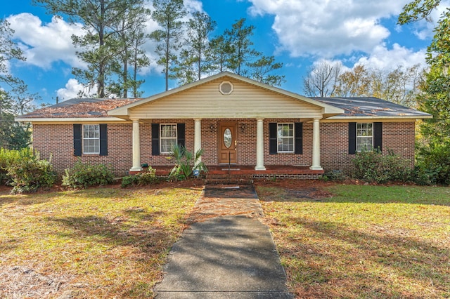 view of front of house with a porch and a front yard