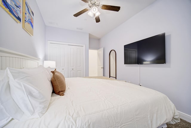 bedroom featuring carpet, ceiling fan, and a closet