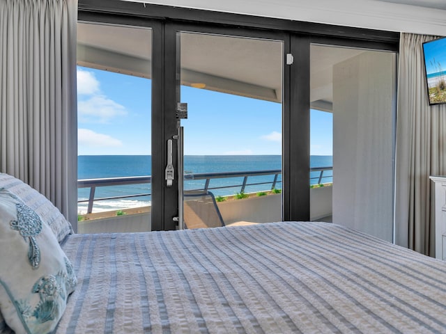 bedroom featuring a water view