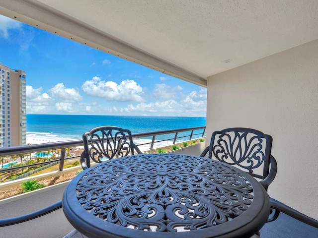 balcony featuring a water view