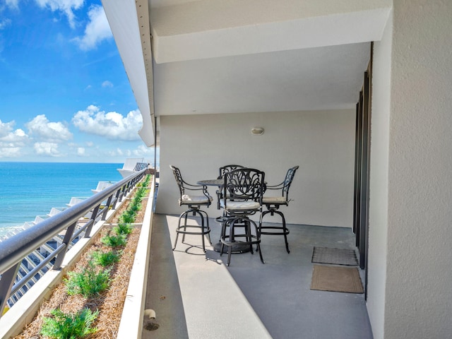 balcony featuring a water view