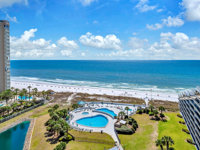 water view featuring a view of the beach and fence