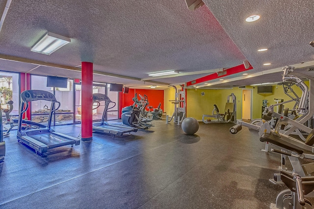 gym featuring a textured ceiling