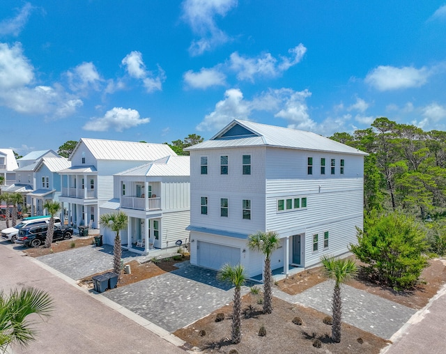 view of front of property with a balcony and a garage