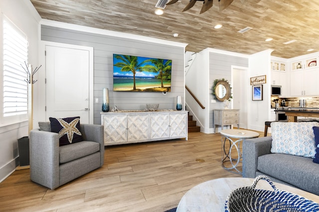 11 Wadleigh Way, Miramar Beach, FL 32550 - living area featuring light wood-style floors, wood walls, wooden ceiling, baseboards, and stairs