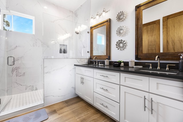 11 Wadleigh Way, Miramar Beach, FL 32550 - full bath with double vanity, a marble finish shower, a sink, and wood finished floors