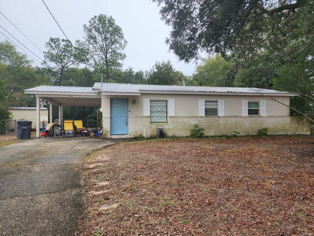 view of front of property with a carport