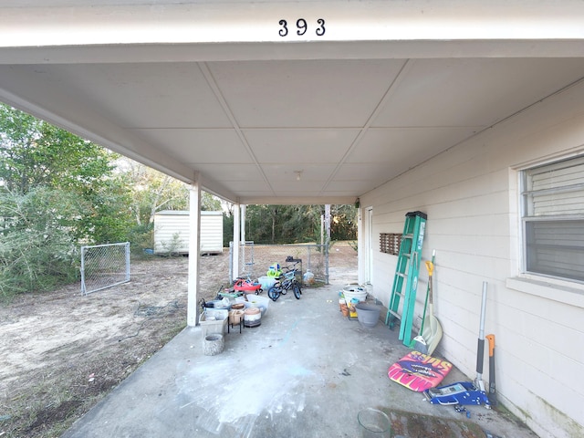 view of patio / terrace with a storage shed