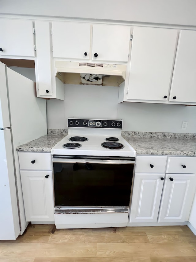 kitchen with light hardwood / wood-style floors, white cabinetry, and white appliances