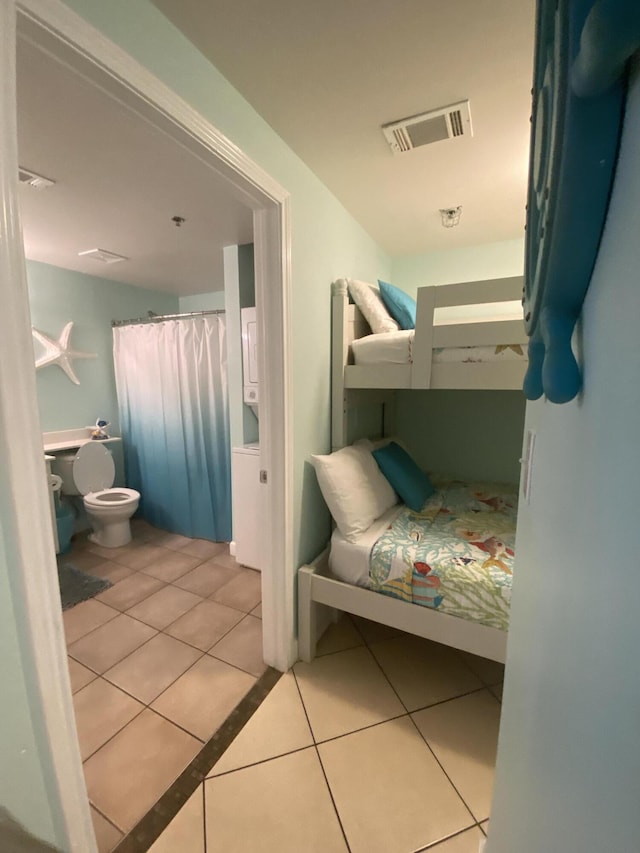 bedroom featuring light tile patterned floors