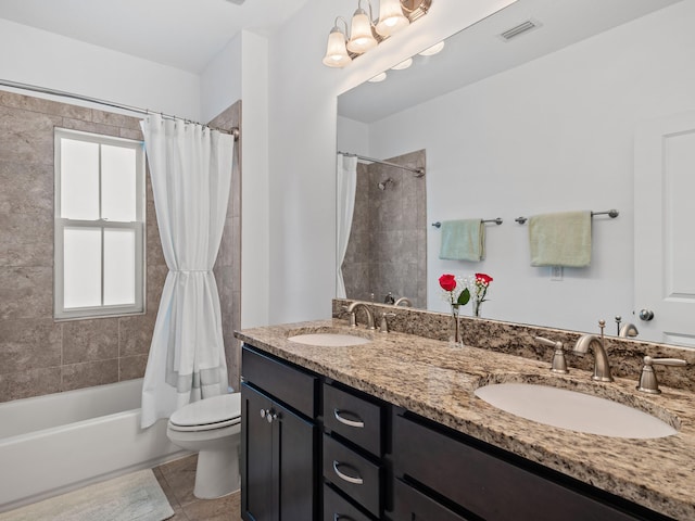 full bathroom with tile patterned floors, vanity, toilet, and shower / bath combo