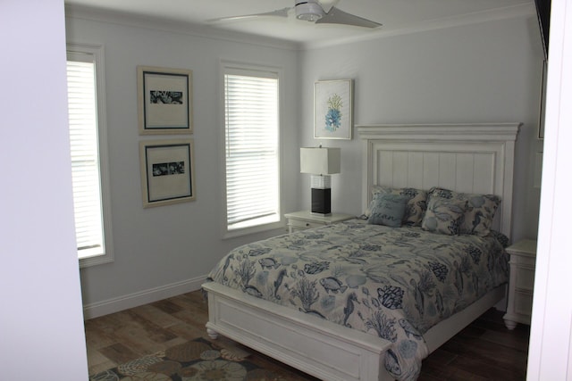 bedroom featuring multiple windows, crown molding, ceiling fan, and dark hardwood / wood-style flooring