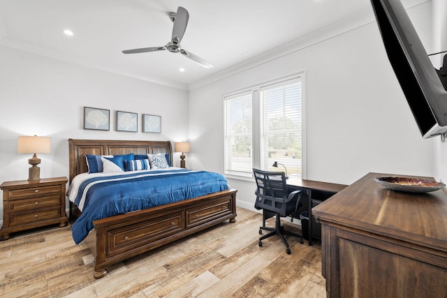 bedroom with ornamental molding, ceiling fan, and light hardwood / wood-style floors