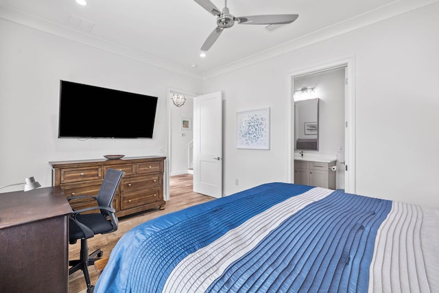 bedroom featuring crown molding, ceiling fan, ensuite bathroom, and light hardwood / wood-style floors