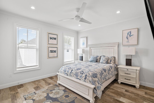 bedroom with dark wood-type flooring, ceiling fan, and crown molding