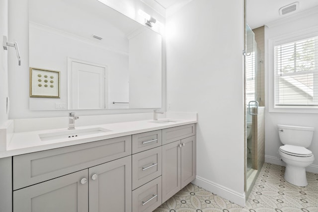 bathroom with vanity, an enclosed shower, crown molding, and toilet