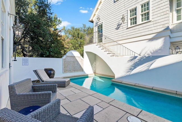 view of swimming pool with a patio