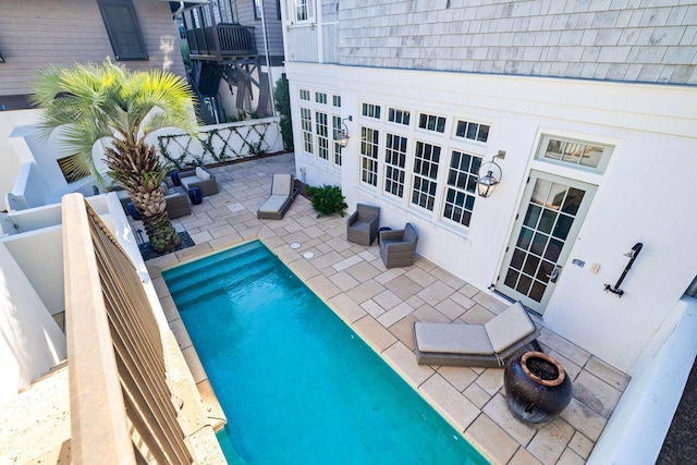 view of pool featuring a patio