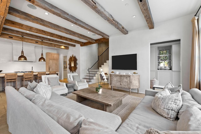 living room with beam ceiling