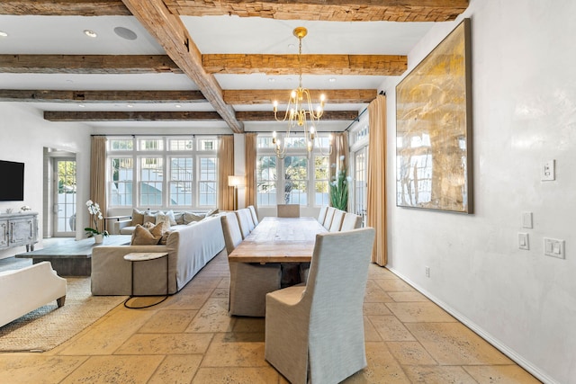 dining area with beamed ceiling and a notable chandelier