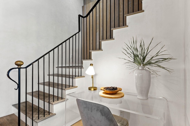 staircase with wood-type flooring