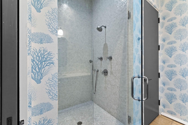 bathroom featuring tile patterned floors and an enclosed shower