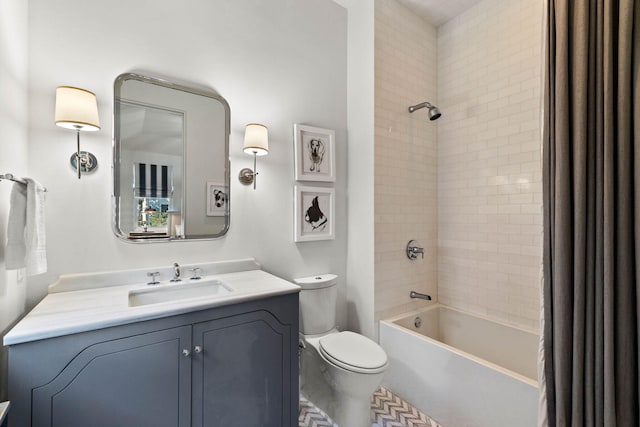 full bathroom featuring washtub / shower combination, vanity, and toilet