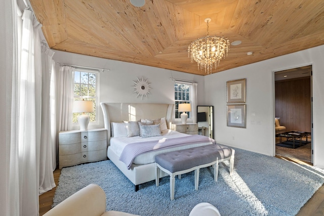 bedroom featuring a chandelier, hardwood / wood-style floors, and wooden ceiling