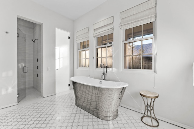 bathroom featuring separate shower and tub