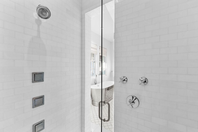 bathroom with tiled shower