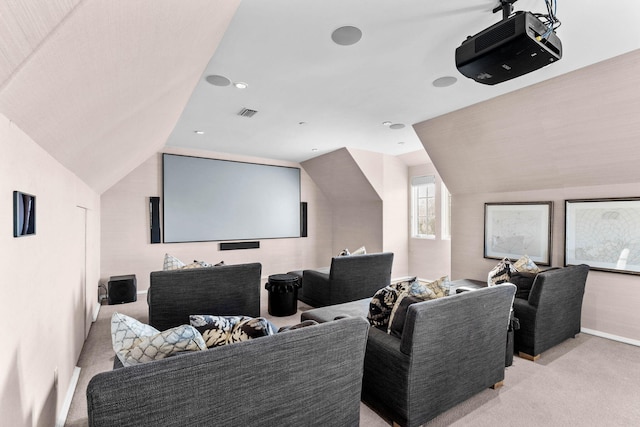 home theater room with light colored carpet and lofted ceiling