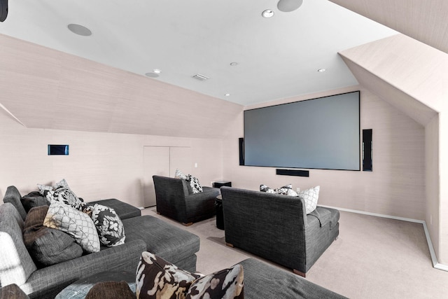 carpeted cinema room featuring lofted ceiling