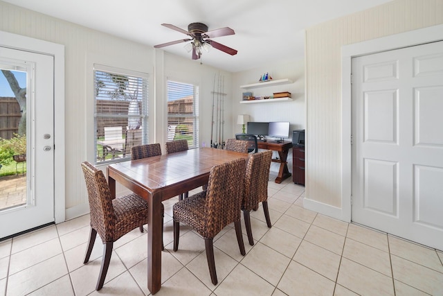 tiled dining area with ceiling fan