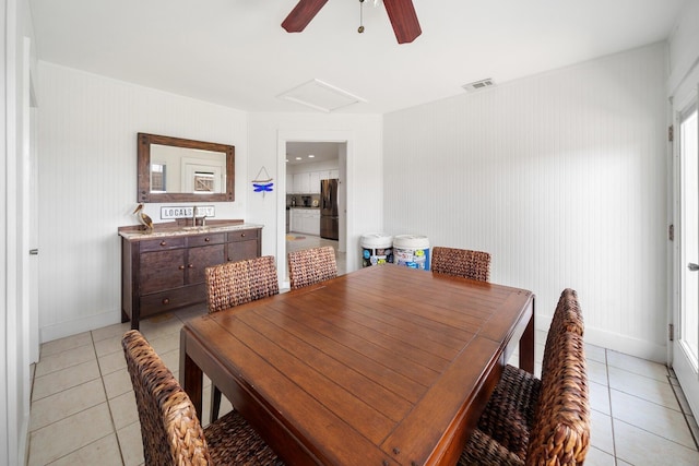 dining room featuring ceiling fan and light tile patterned flooring