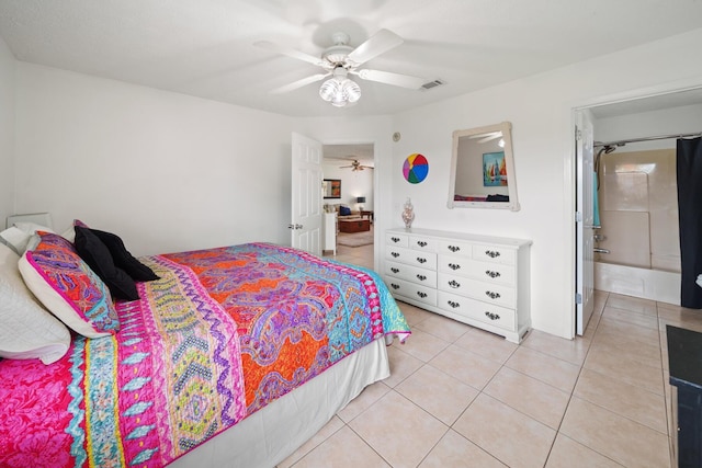 bedroom with ceiling fan, light tile patterned floors, and connected bathroom