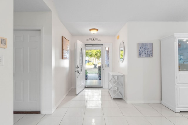 entrance foyer with light tile patterned floors