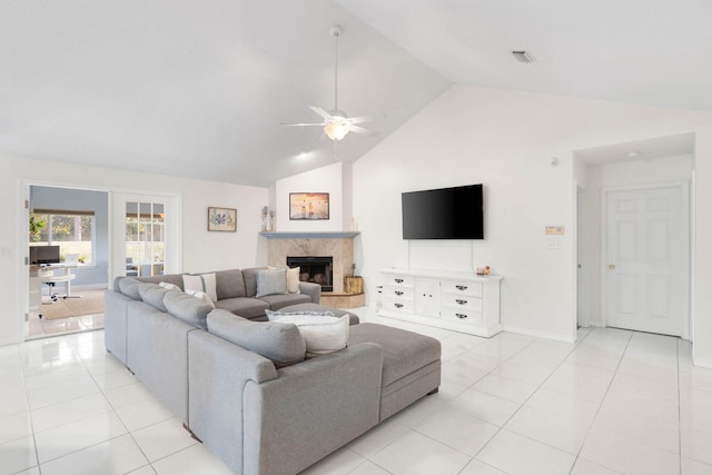 living room featuring high vaulted ceiling, ceiling fan, and light tile patterned floors