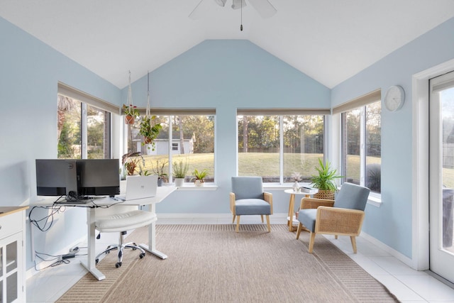 office with ceiling fan, lofted ceiling, and light tile patterned floors