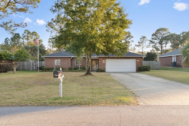 ranch-style home featuring a front yard and a garage