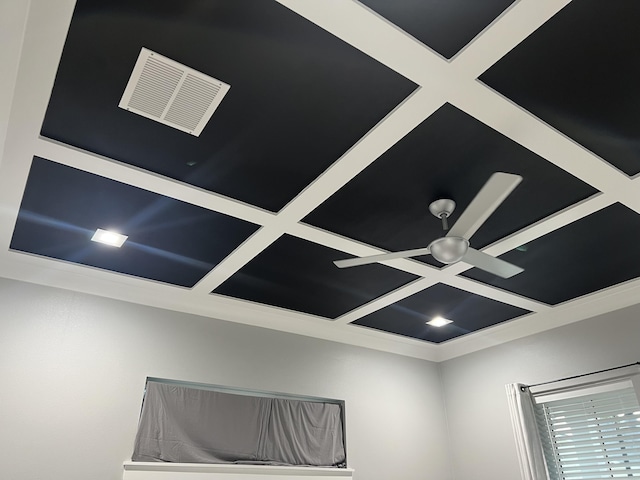 interior details featuring beamed ceiling, crown molding, and coffered ceiling