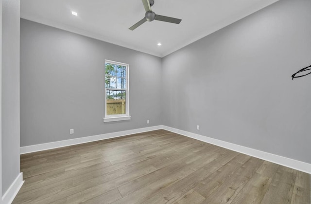 spare room featuring ceiling fan and light hardwood / wood-style floors