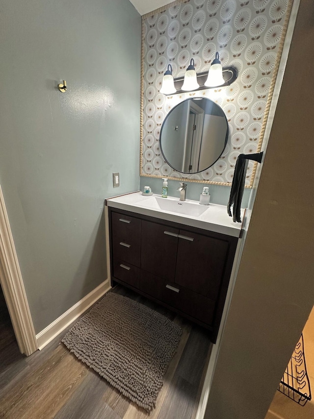 bathroom featuring vanity and hardwood / wood-style flooring