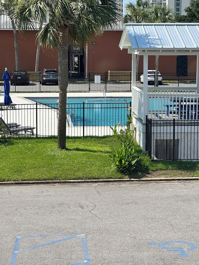 view of swimming pool featuring a patio