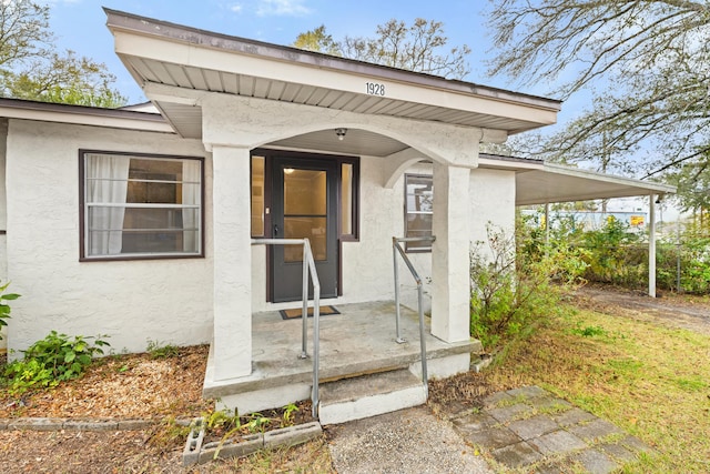 entrance to property with a carport