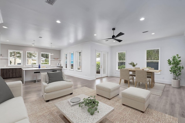 156 Beacon Point Dr, Santa Rosa Beach, FL 32459 - living room featuring light wood finished floors, ornamental molding, recessed lighting, ceiling fan, and baseboards