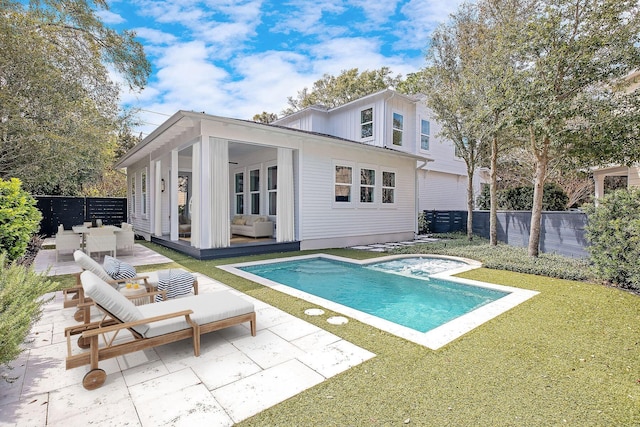 156 Beacon Point Dr, Santa Rosa Beach, FL 32459 - rear view of house with an outdoor hangout area, a patio, board and batten siding, and an in-ground hot tub