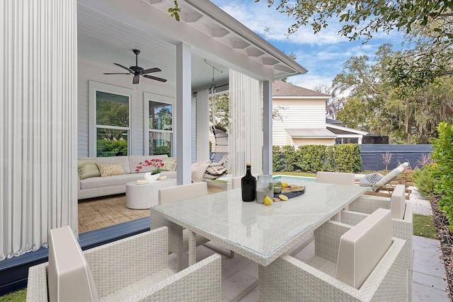 156 Beacon Point Dr, Santa Rosa Beach, FL 32459 - view of patio featuring outdoor dining space, ceiling fan, outdoor lounge area, a swimming pool, and fence