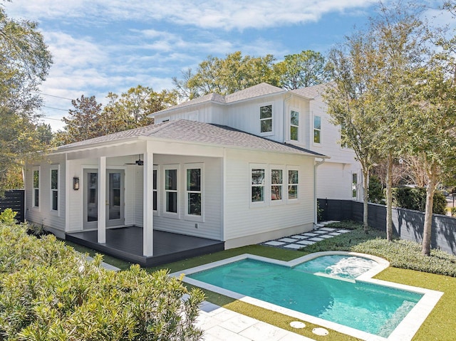 156 Beacon Point Dr, Santa Rosa Beach, FL 32459 - back of house with fence, a hot tub, a ceiling fan, roof with shingles, and a patio area