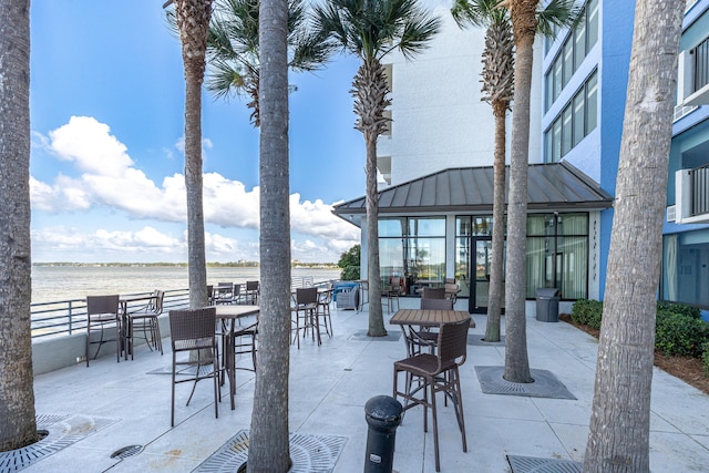 view of patio featuring a water view