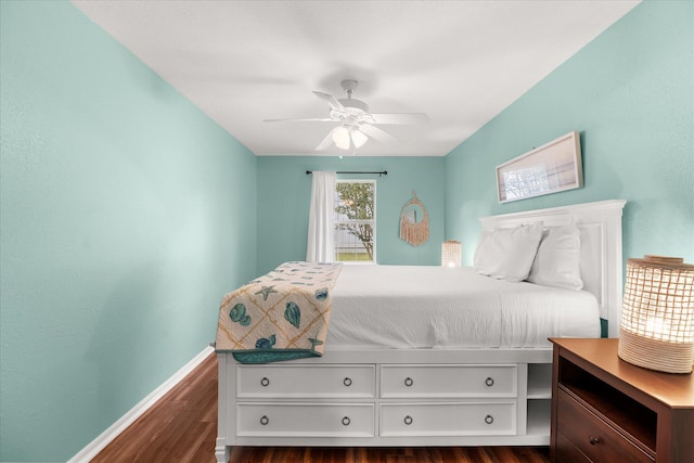 bedroom with ceiling fan and dark hardwood / wood-style flooring